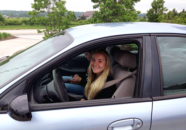 Girl happy to be back in car after being locked out of her car in Fond du Lac, Wisconsin.